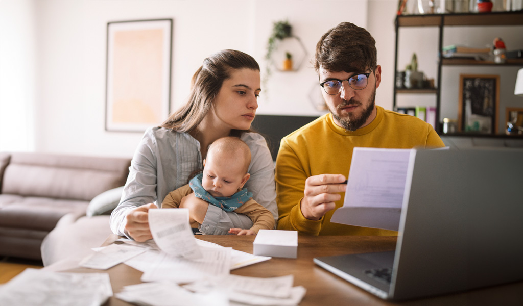 couple with child preparing tax paperwork